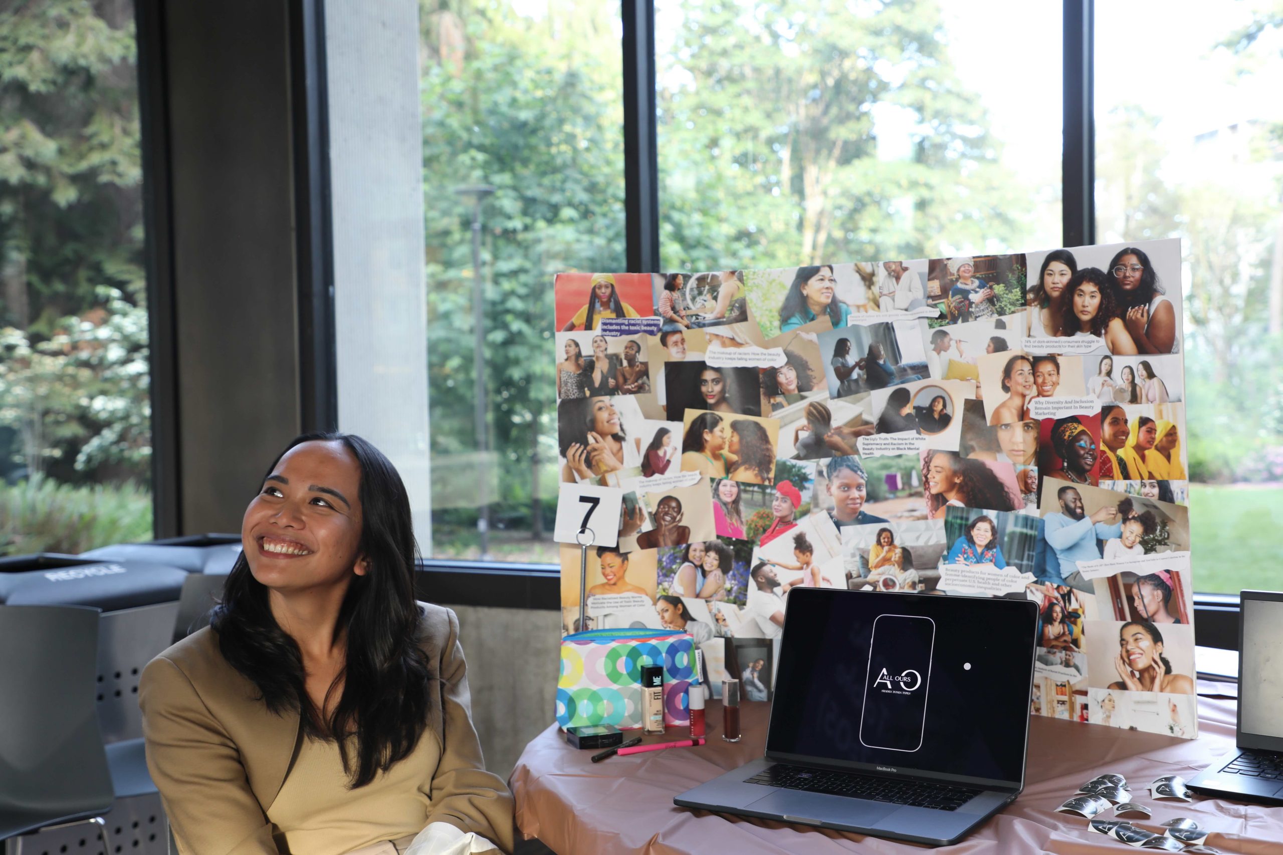 Student presenting visual piece of their project