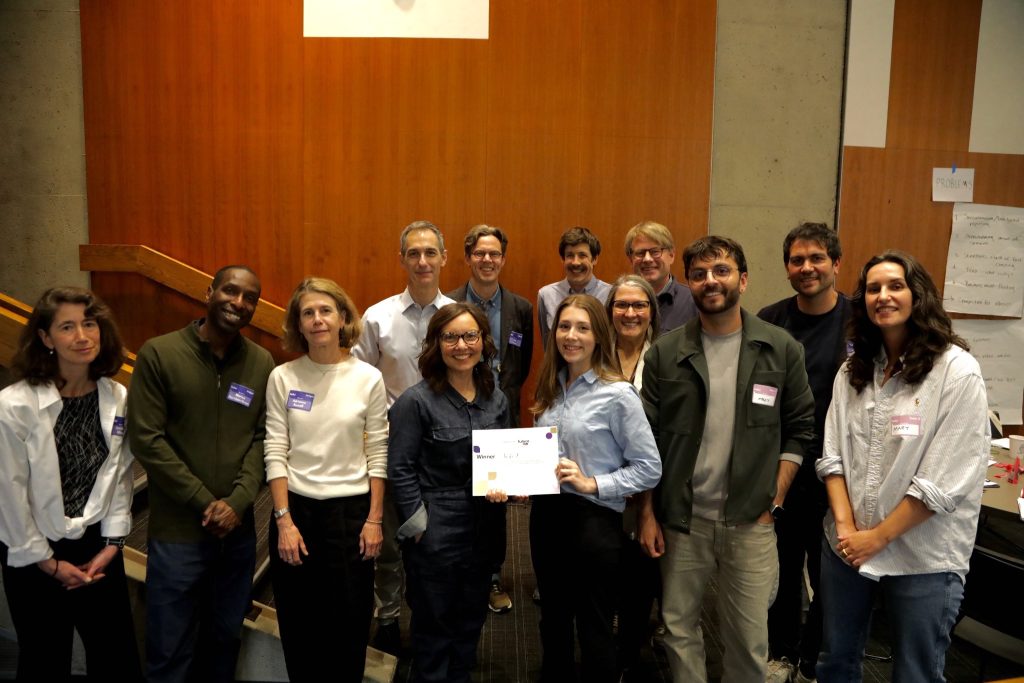 The winning team alongside the judges